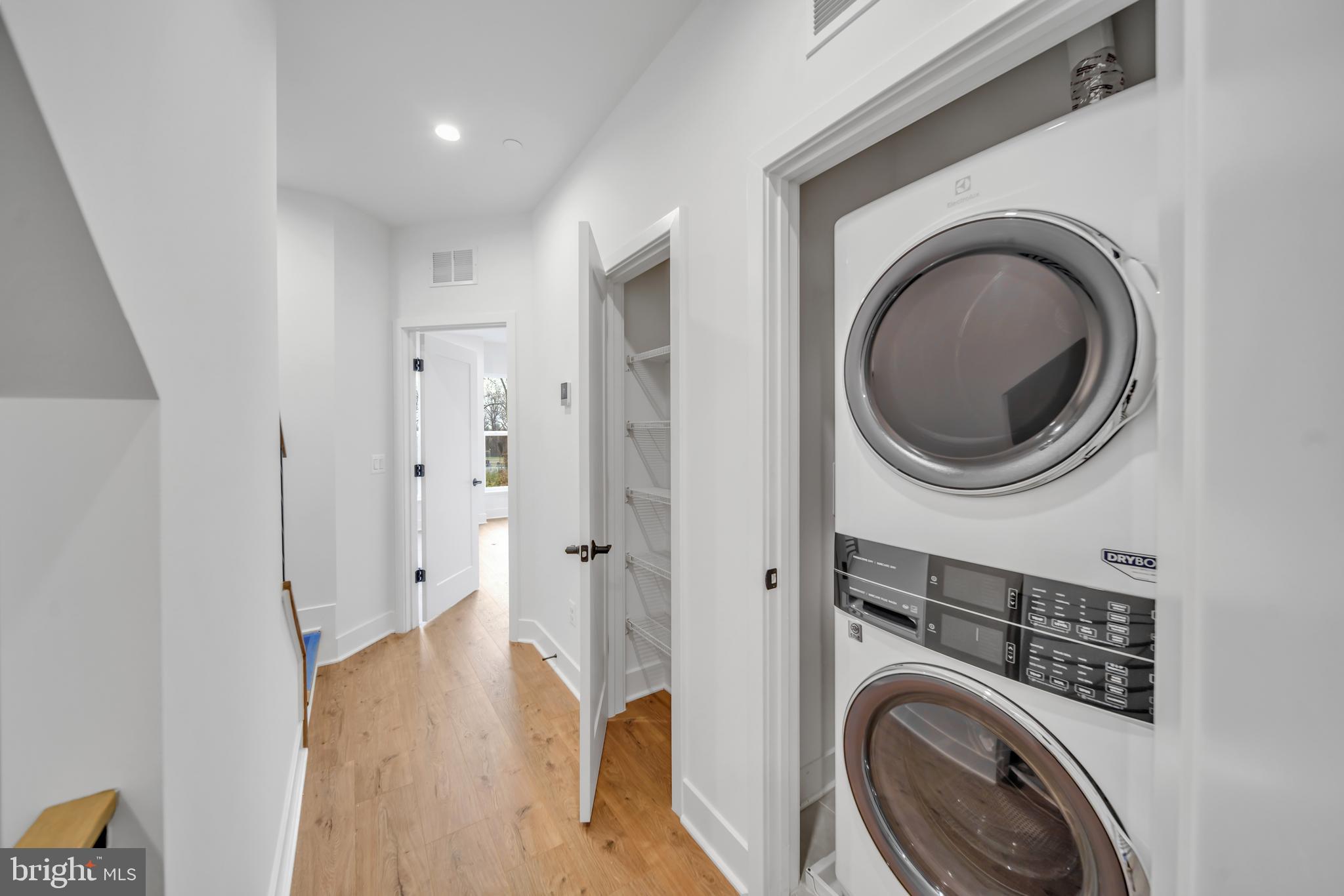 5420 Goshawk Alley Bethesda, MD 20816 - Photo 15 of 57 a view of a hallway with washer and dryer