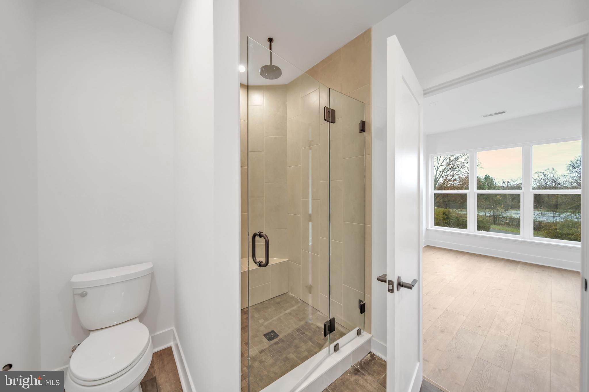 5420 Goshawk Alley Bethesda, MD 20816 - Photo 21 of 57 a bathroom with a shower and toilet