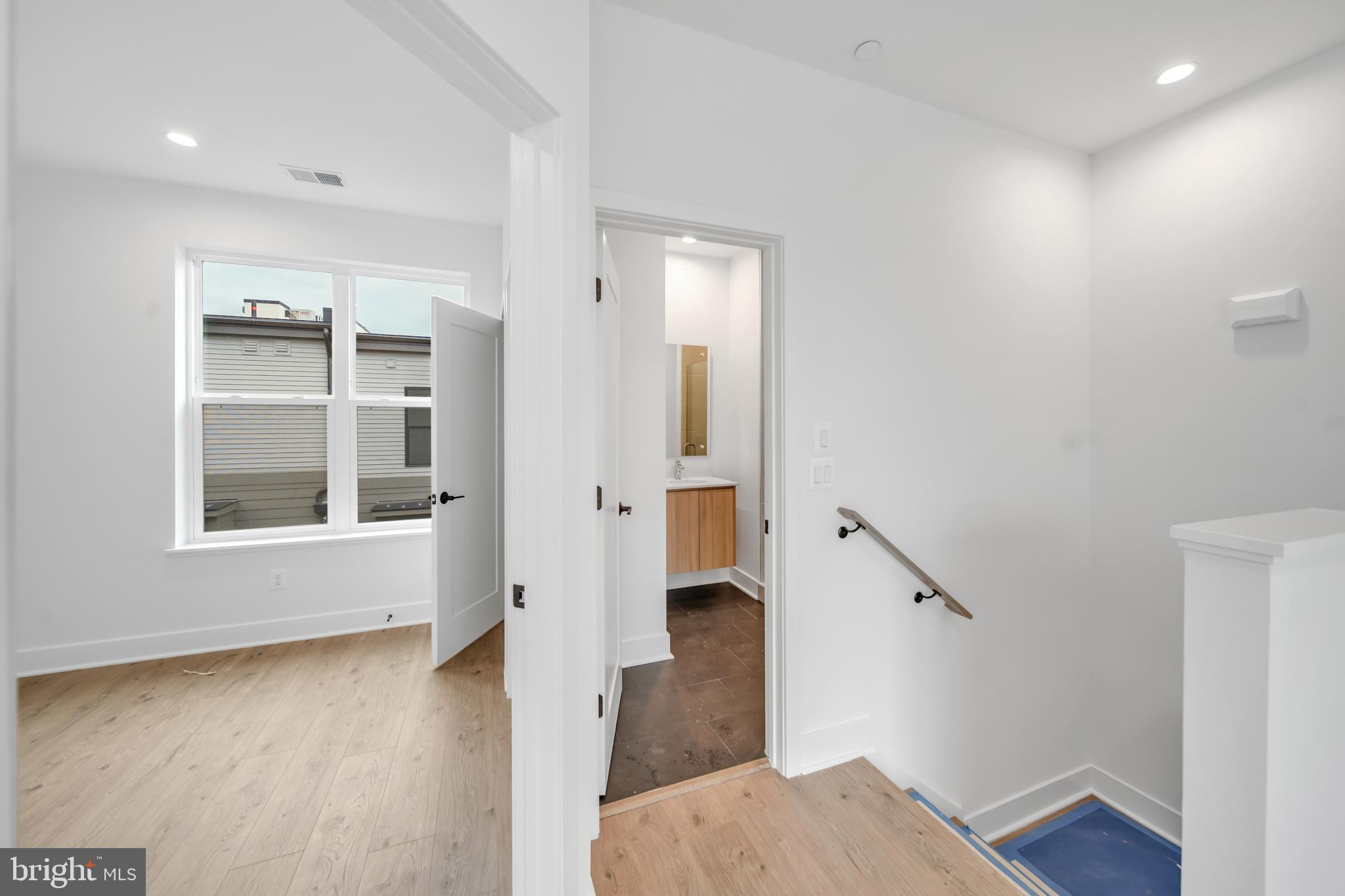 5420 Goshawk Alley Bethesda, MD 20816 - Photo 25 of 57 a view of entryway with wooden floor and a front door