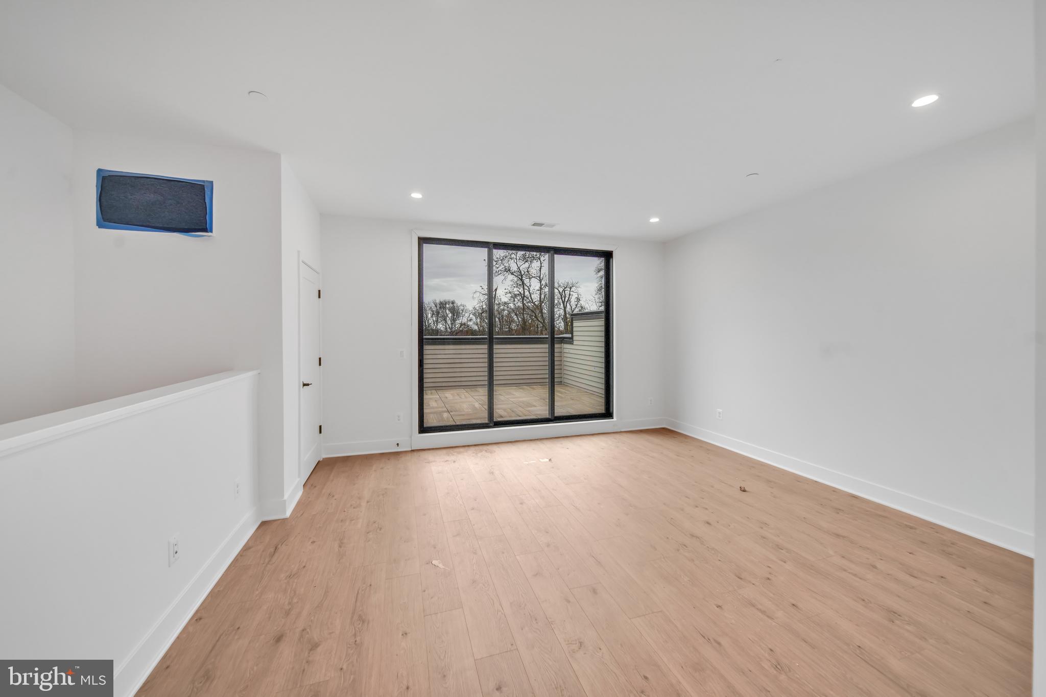 5420 Goshawk Alley Bethesda, MD 20816 - Photo 30 of 57 wooden floor in an empty room with a window
