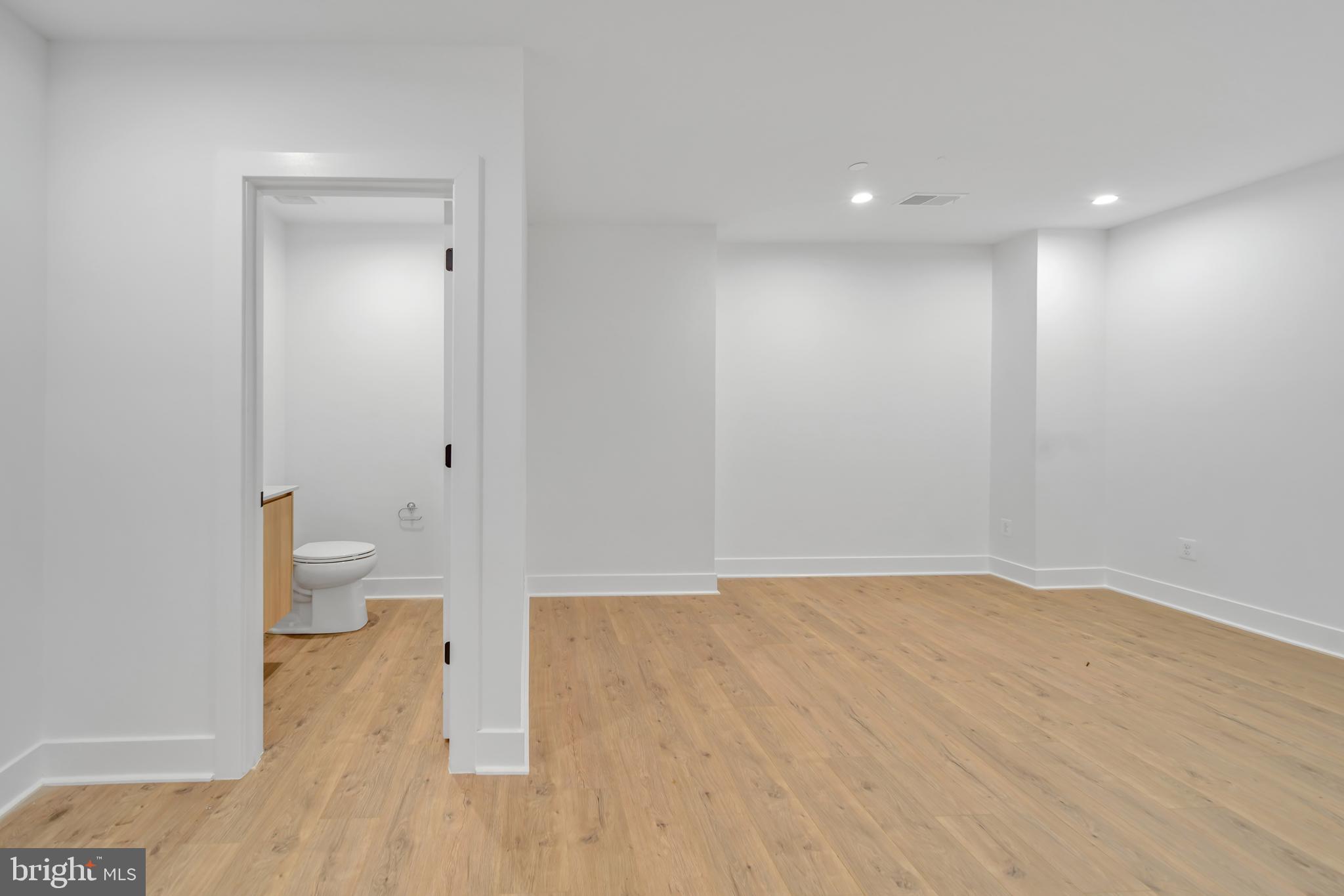 5420 Goshawk Alley Bethesda, MD 20816 - Photo 36 of 57 a view of room with wooden floor and toilet