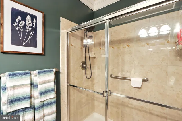 a bathroom with a glass shower door
