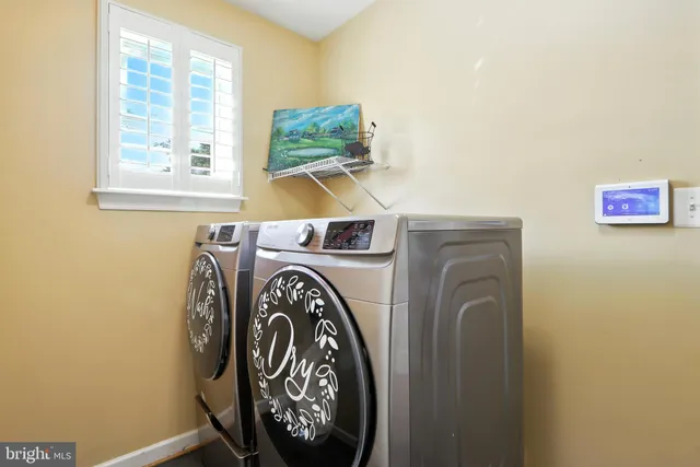 a utility room with dryer and washer