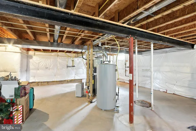 a view of a roof deck with table and chairs under an umbrella with wooden floor