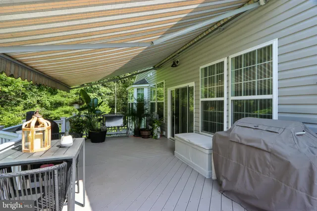 a front view of a house with a yard balcony