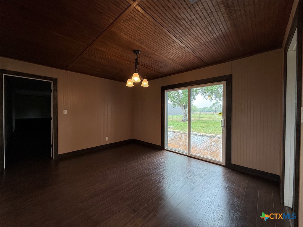 2243 Old Goliad Road Victoria, TX 77905 - Photo 20 of 47 a view of a livingroom with wooden floor and a large window
