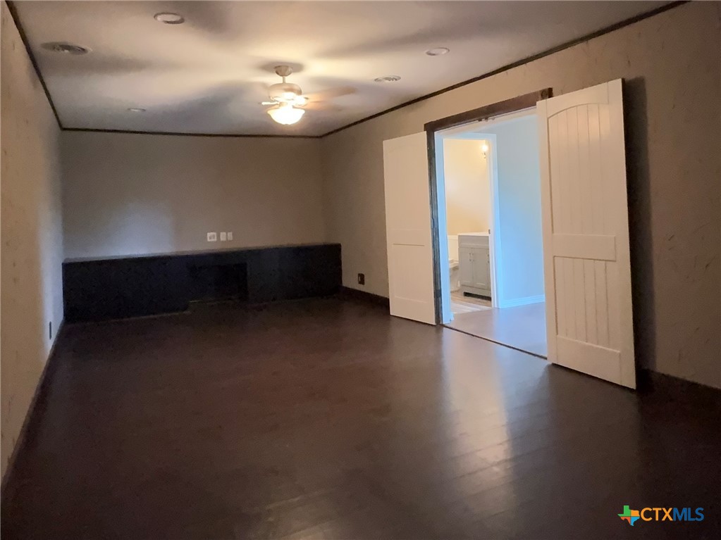 2243 Old Goliad Road Victoria, TX 77905 - Photo 30 of 47 a view of room with window and wooden floor