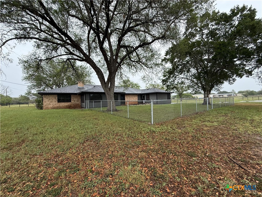 2243 Old Goliad Road Victoria, TX 77905 - Photo 3 of 47 a view of a house with a yard