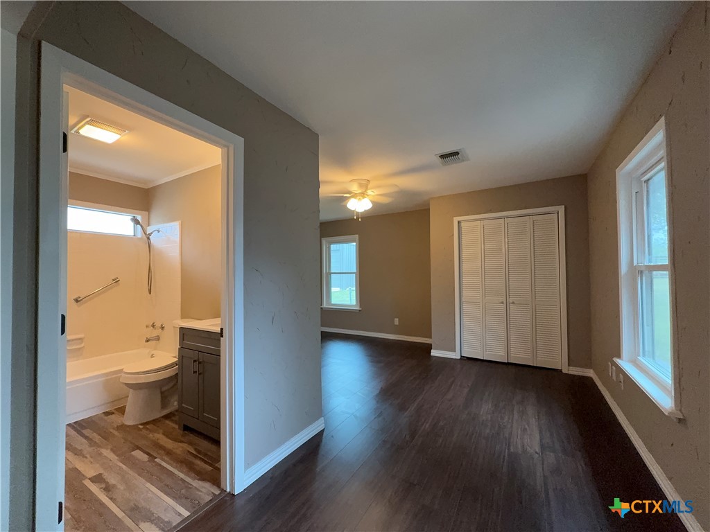 2243 Old Goliad Road Victoria, TX 77905 - Photo 32 of 47 a bathroom with a toilet and a shower