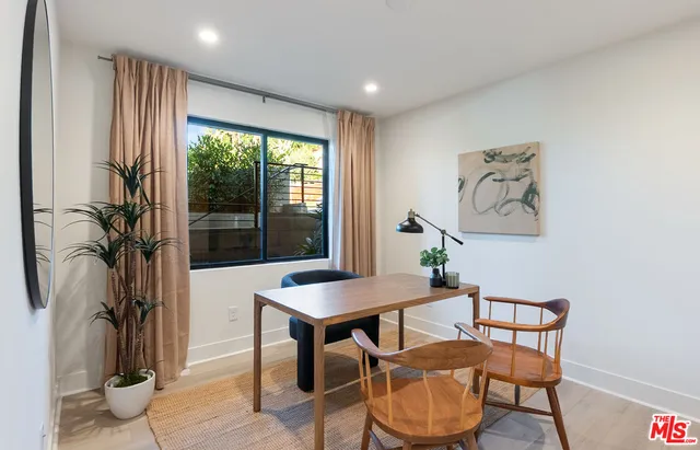 a workspace with furniture and a window