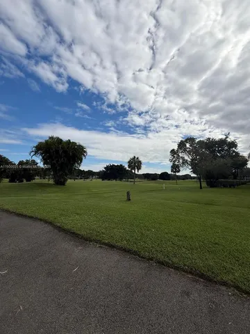 a view of house with outdoor space and lake