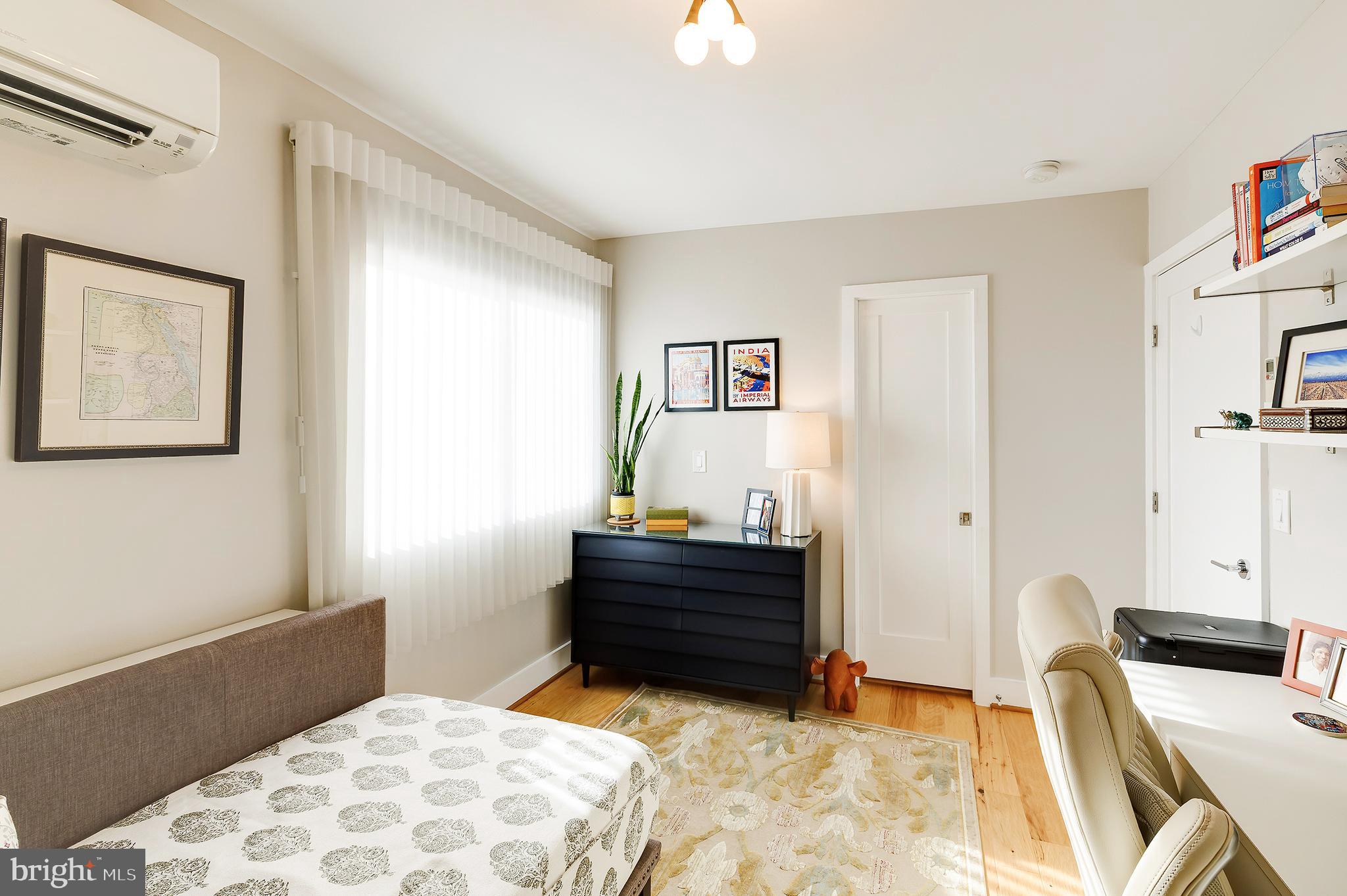 1514 Newton Street Northwest, Unit 301 Washington, DC 20010 - Photo 23 of 30 a bedroom with a bed and a dresser