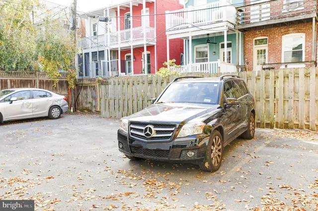 a car parked in front of a house