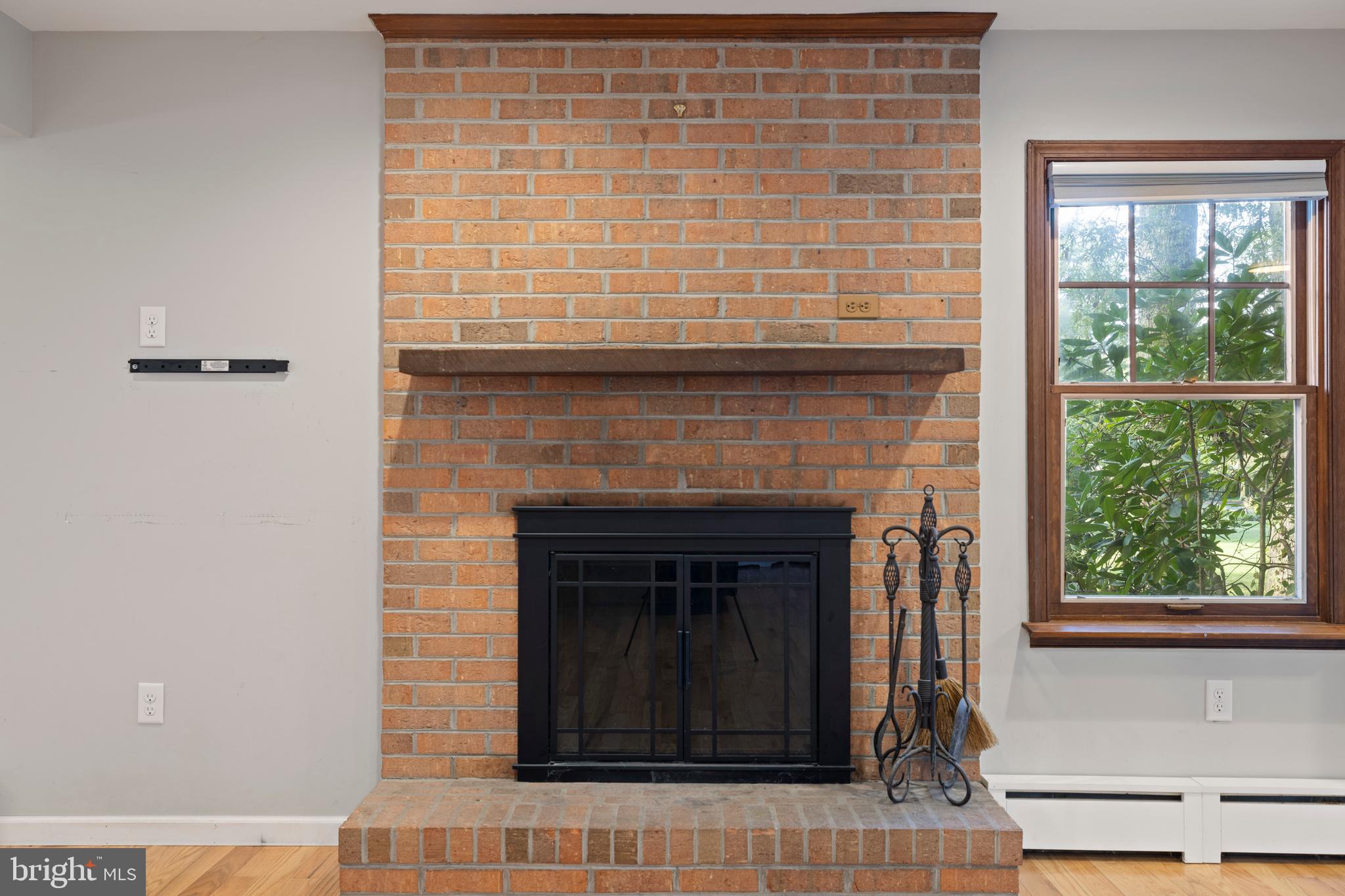 108 Primrose Road Chestertown, MD 21620 - Photo 11 of 49 a living room with a fireplace and a window