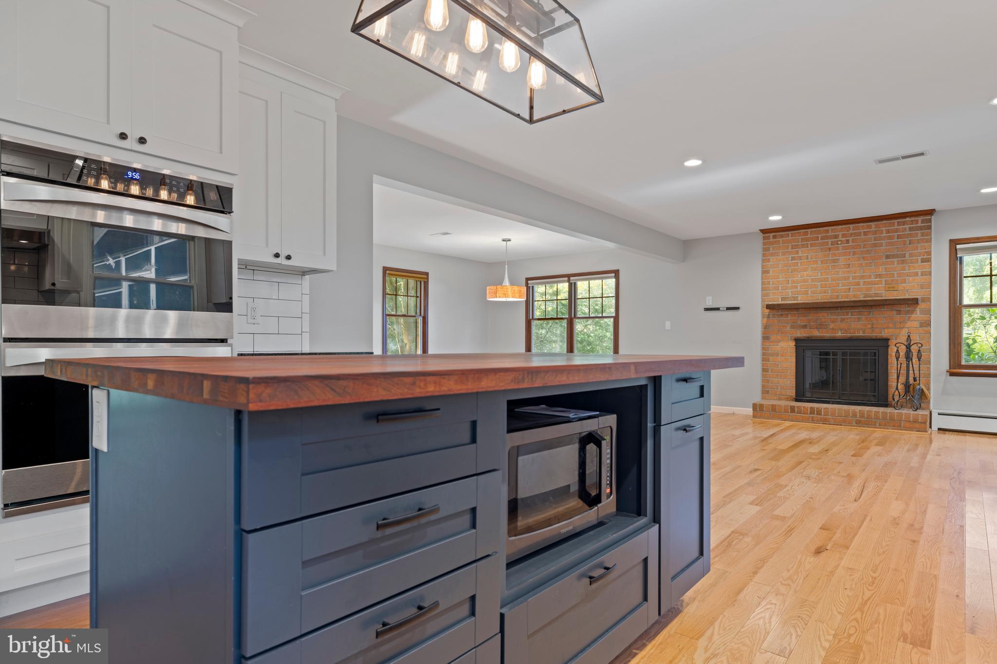 108 Primrose Road Chestertown, MD 21620 - Photo 13 of 49 a kitchen with stainless steel appliances granite countertop a stove and a microwave