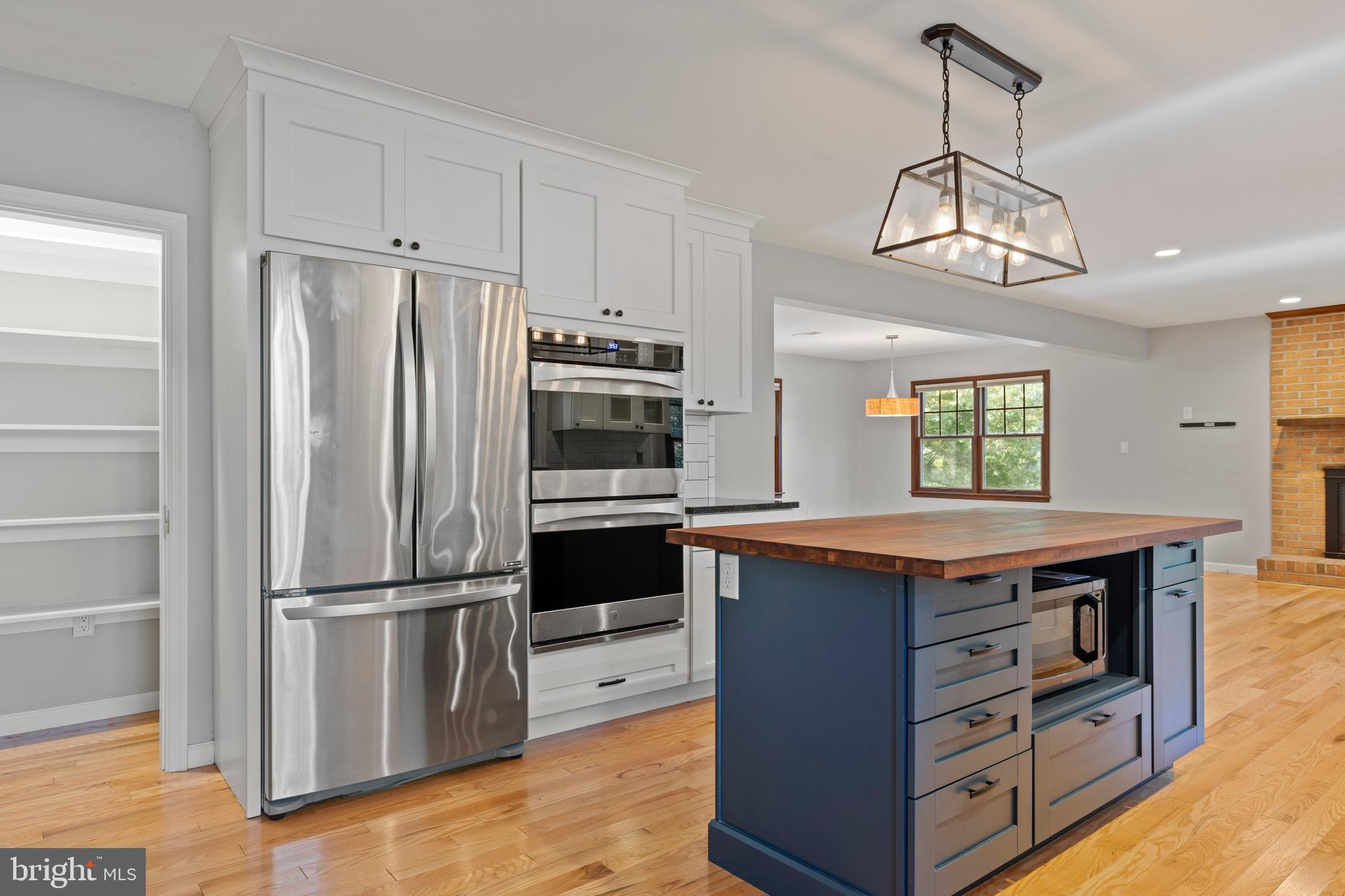 108 Primrose Road Chestertown, MD 21620 - Photo 14 of 49 a kitchen with stainless steel appliances granite countertop a refrigerator a stove and a refrigerator