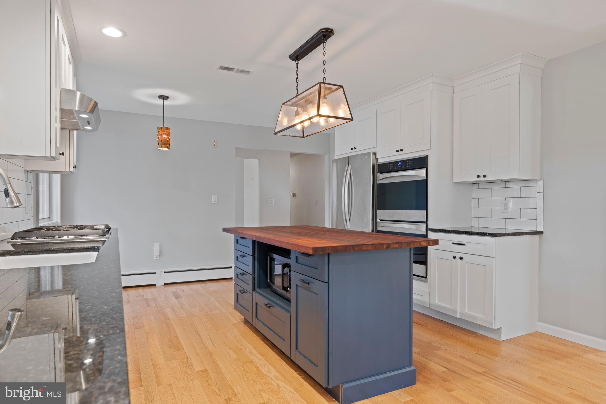 108 Primrose Road Chestertown, MD 21620 - Photo 15 of 49 a kitchen with stainless steel appliances granite countertop a stove and a refrigerator
