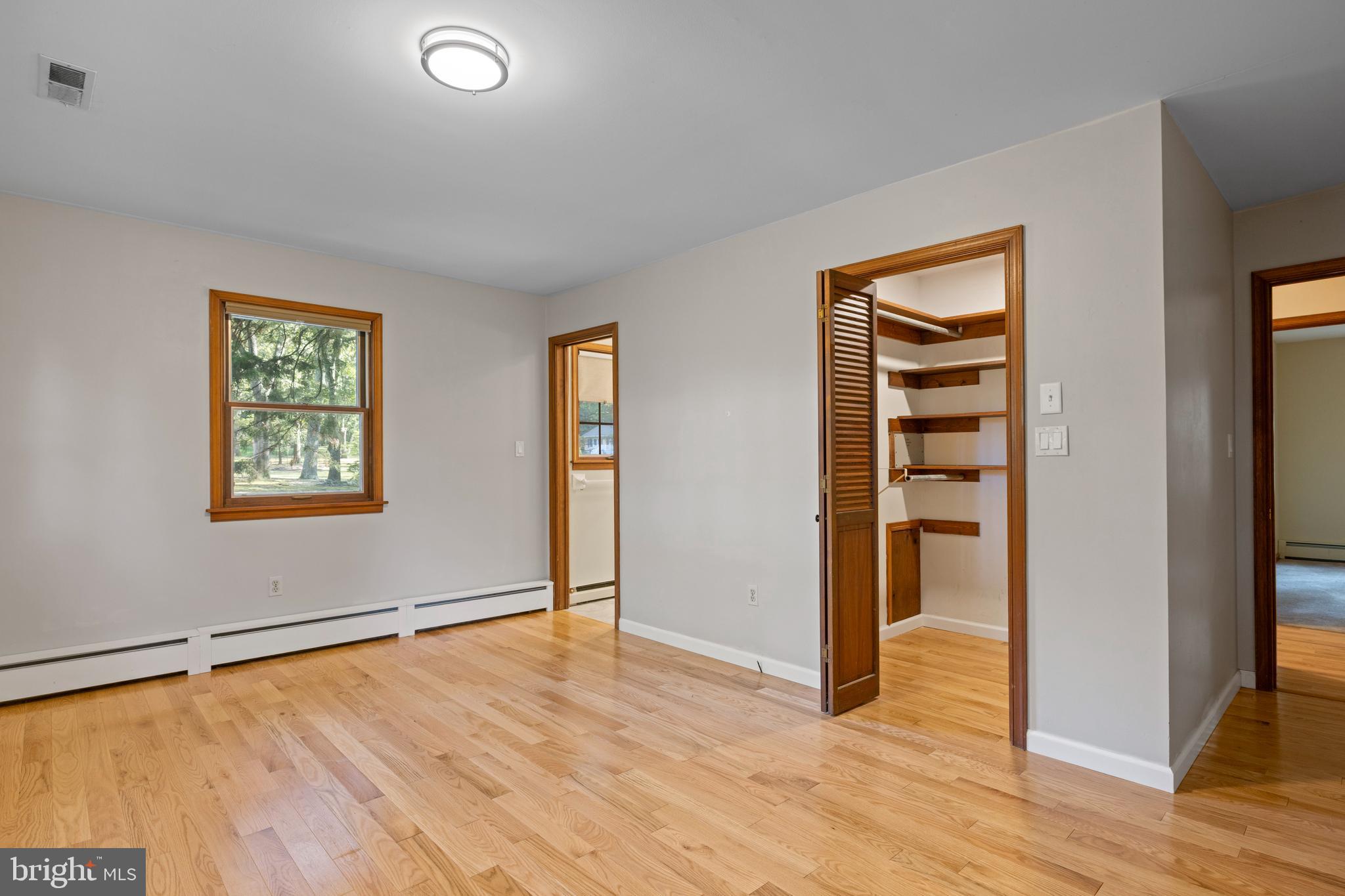 108 Primrose Road Chestertown, MD 21620 - Photo 19 of 49 an empty room with wooden floor closet and windows