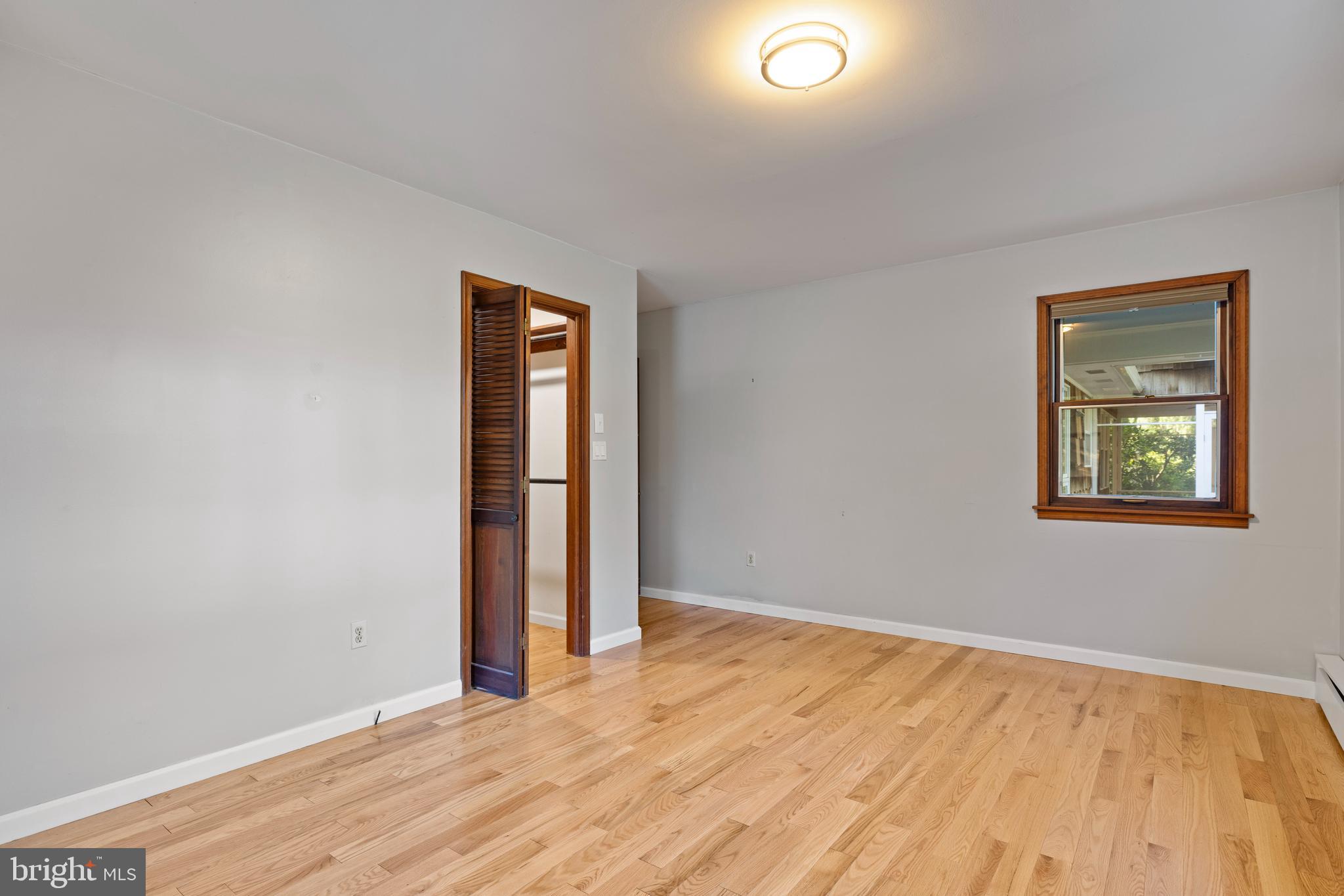 108 Primrose Road Chestertown, MD 21620 - Photo 22 of 49 a view of an empty room with wooden floor and a window