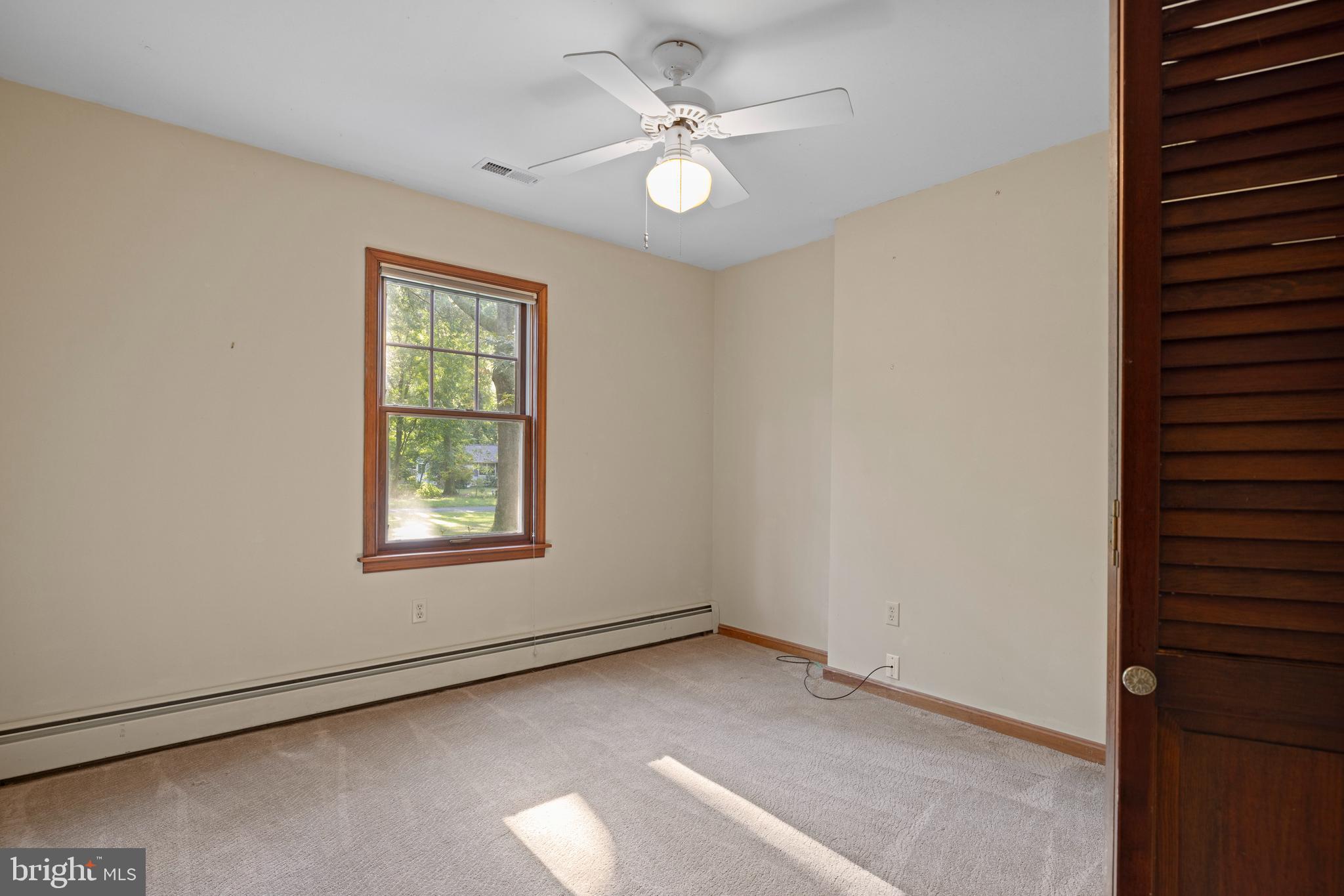 108 Primrose Road Chestertown, MD 21620 - Photo 27 of 49 an empty room with windows and ceiling fan