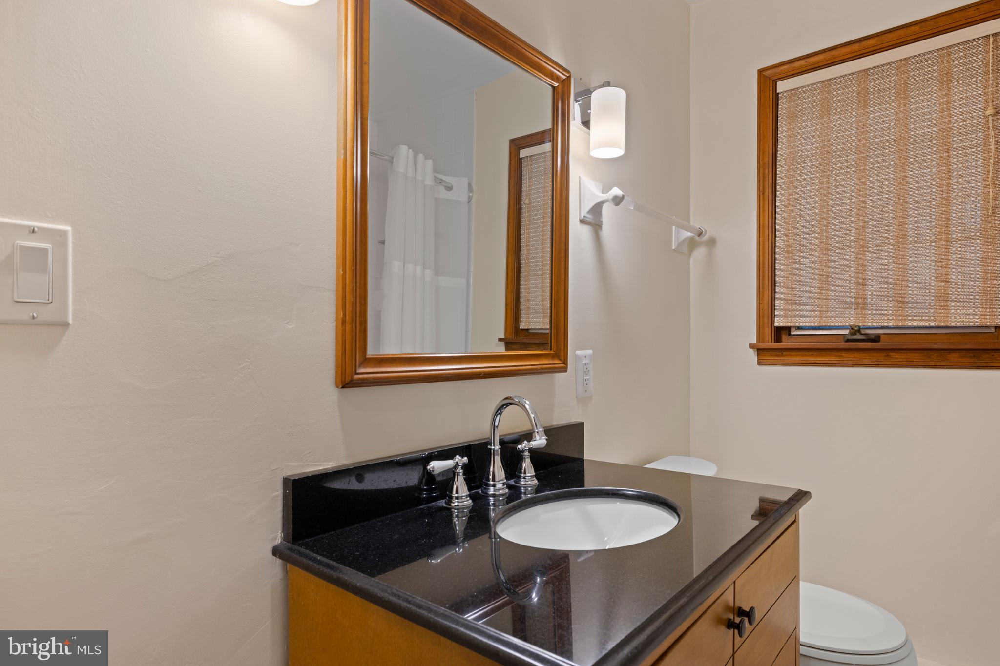 108 Primrose Road Chestertown, MD 21620 - Photo 31 of 49 a bathroom with a granite countertop sink and a mirror