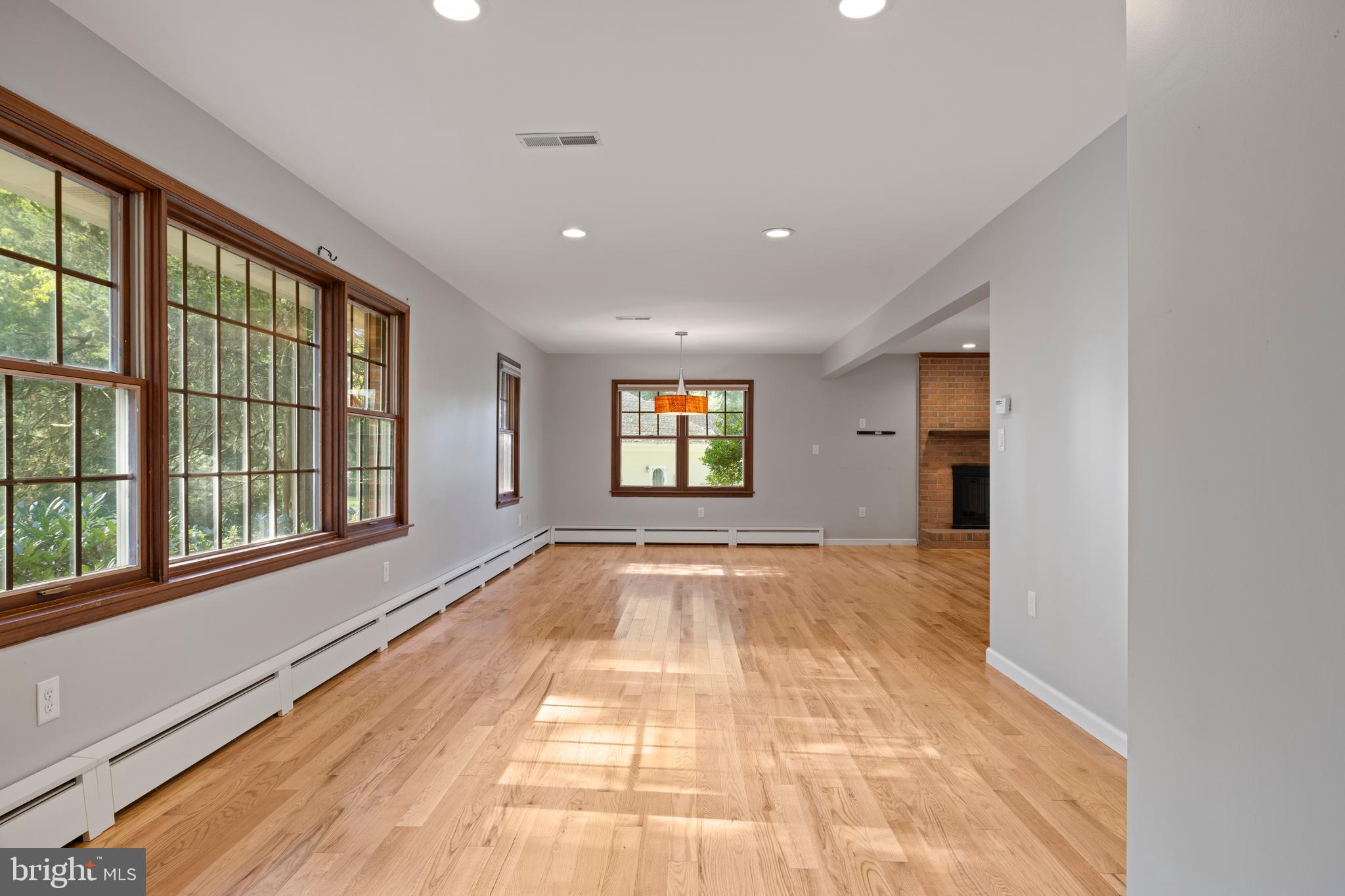 108 Primrose Road Chestertown, MD 21620 - Photo 8 of 49 a view of an empty room with a window and wooden floor