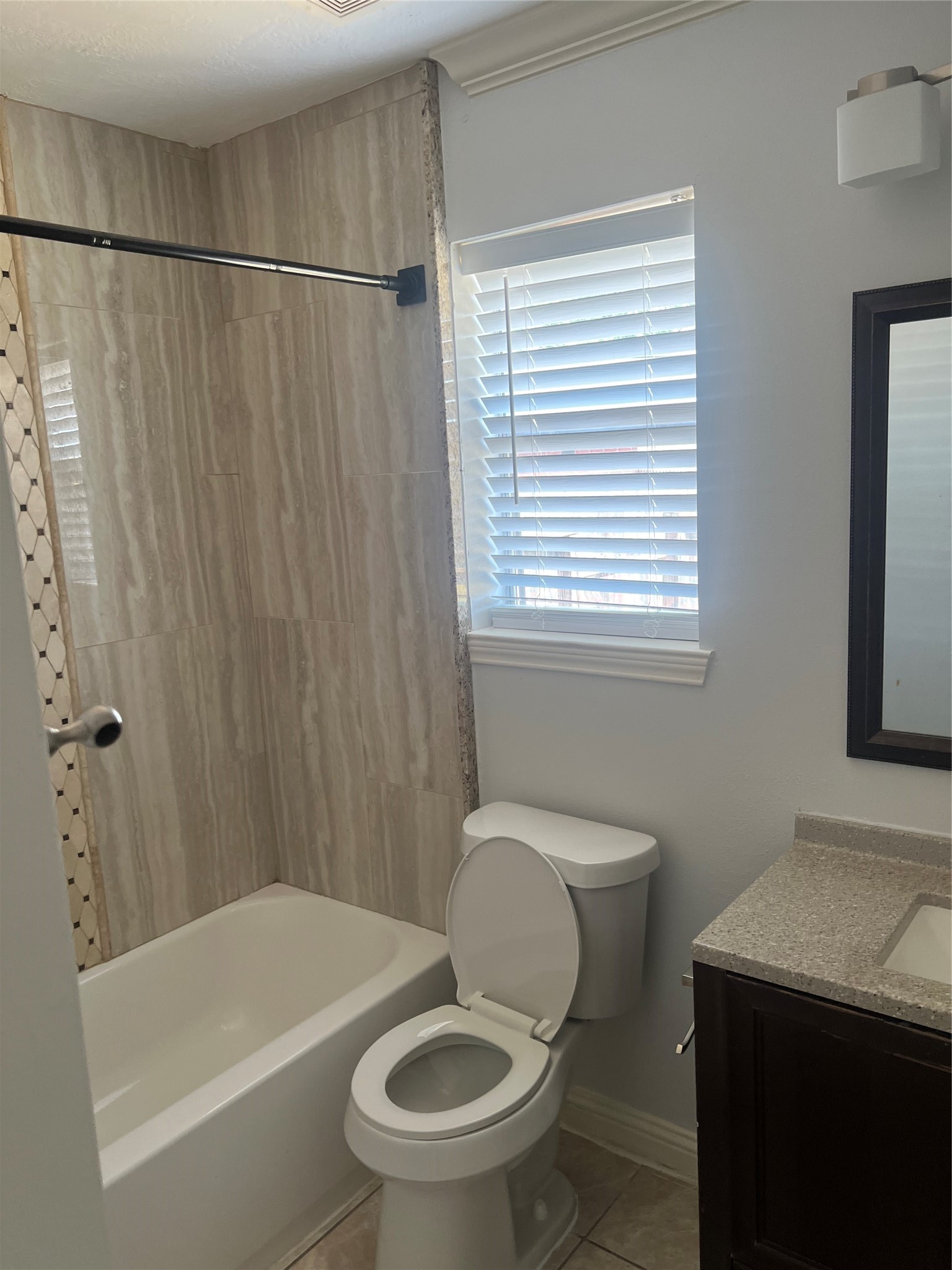 15303 Riverside Grove Drive Houston, TX 77083 - Photo 3 of 10 a white toilet sitting next to a bathroom sink