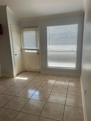a view of a utility room and empty room