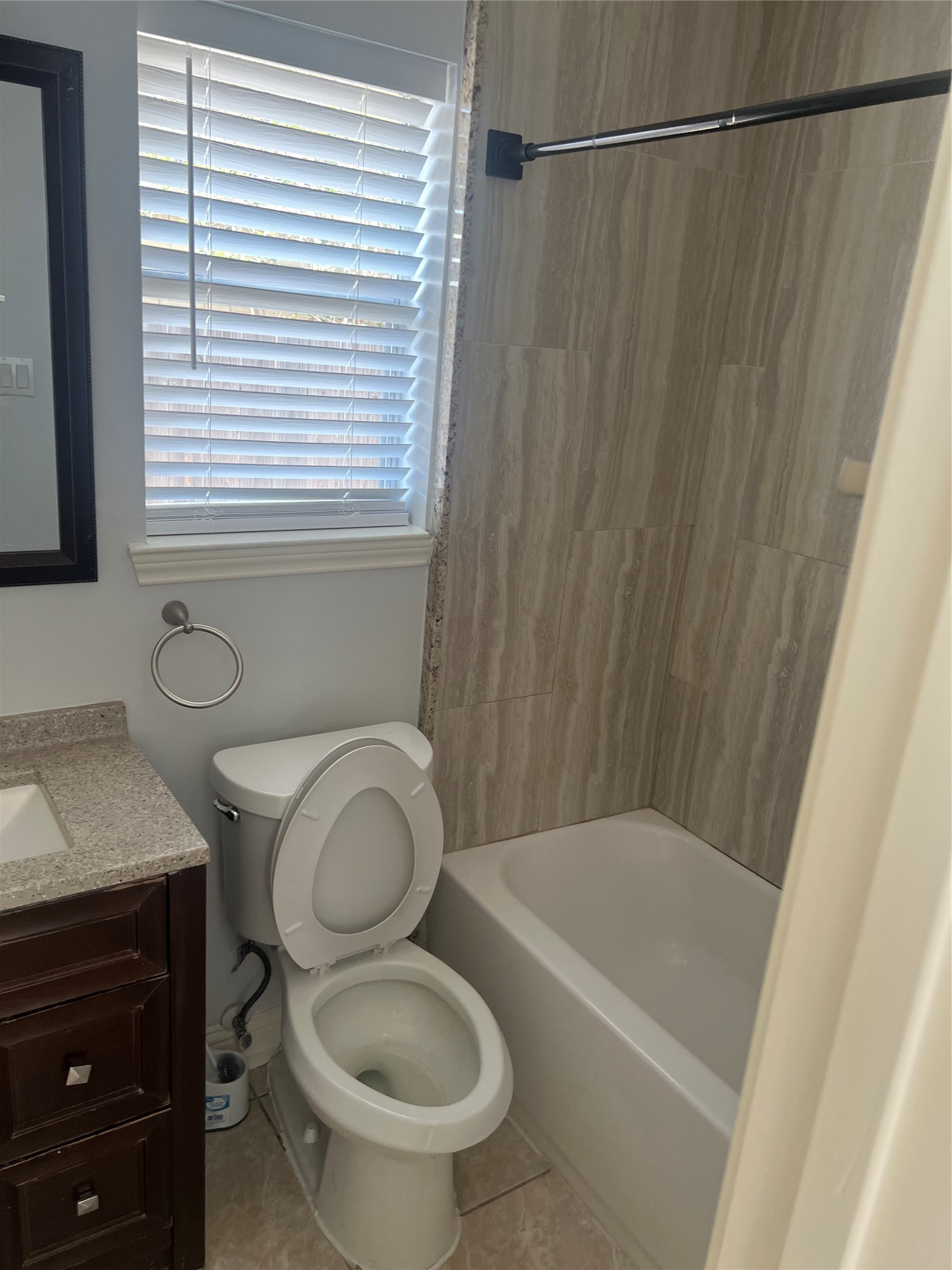 15303 Riverside Grove Drive Houston, TX 77083 - Photo 8 of 10 a bathroom with a granite countertop bathtub sink vanity mirror and toilet