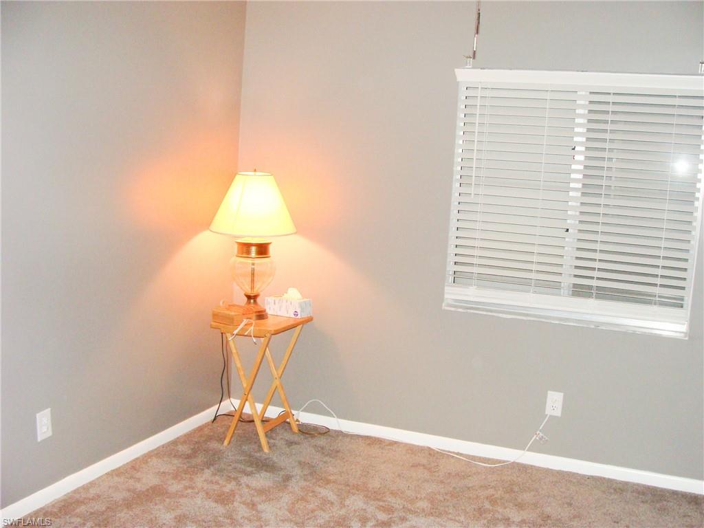 5693 Rattlesnake Hamm Road, Unit A204 Naples, FL 34113 - Photo 16 of 29 a view of a room with a window