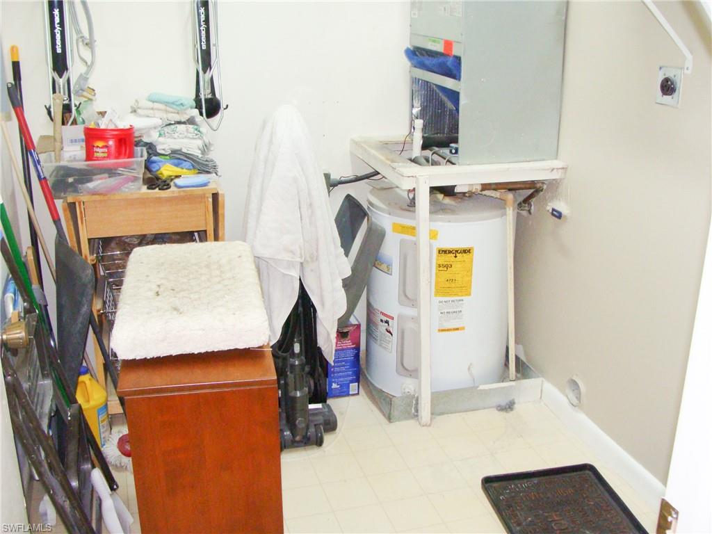 5693 Rattlesnake Hamm Road, Unit A204 Naples, FL 34113 - Photo 19 of 29 a utility room with dryer and washer