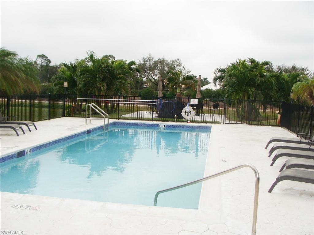 5693 Rattlesnake Hamm Road, Unit A204 Naples, FL 34113 - Photo 23 of 29 a view of a swimming pool with a slide