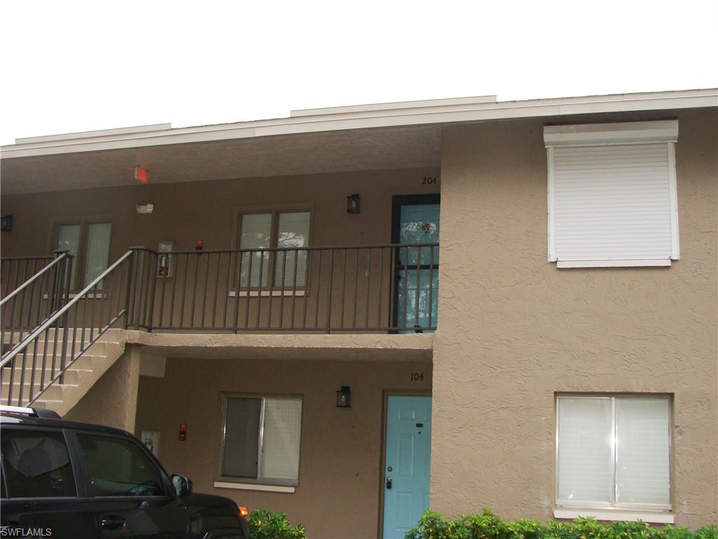 5693 Rattlesnake Hamm Road, Unit A204 Naples, FL 34113 - Photo 29 of 29 a view of a car garage