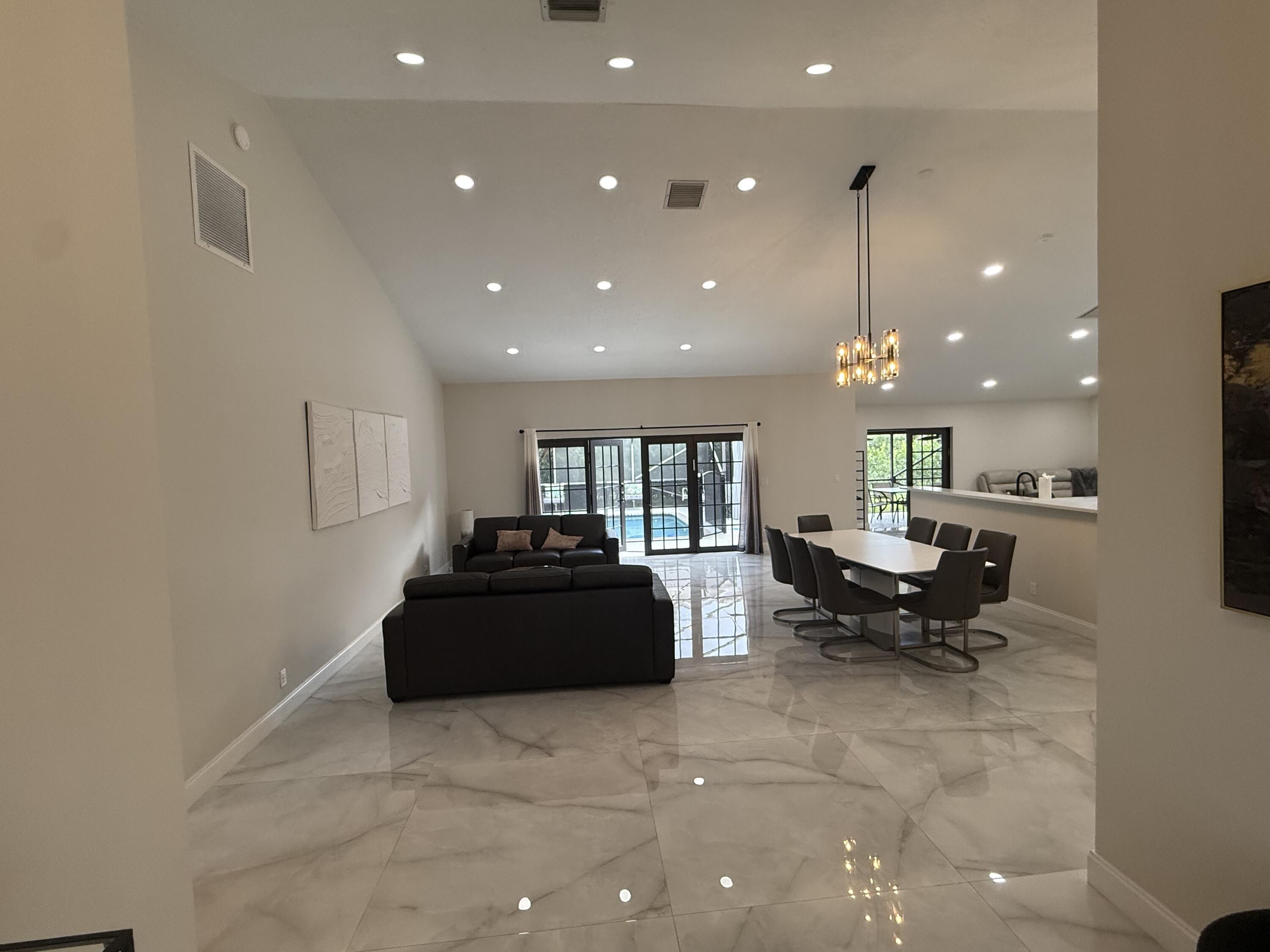 9629 El Clair Ranch Road Boynton Beach, FL 33437 - Photo 2 of 24 the living and dining rooms