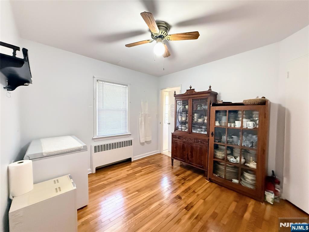 216 Cedar Lane Closter, NJ 07624 - Photo 11 of 15 a living room with furniture and a wooden floor