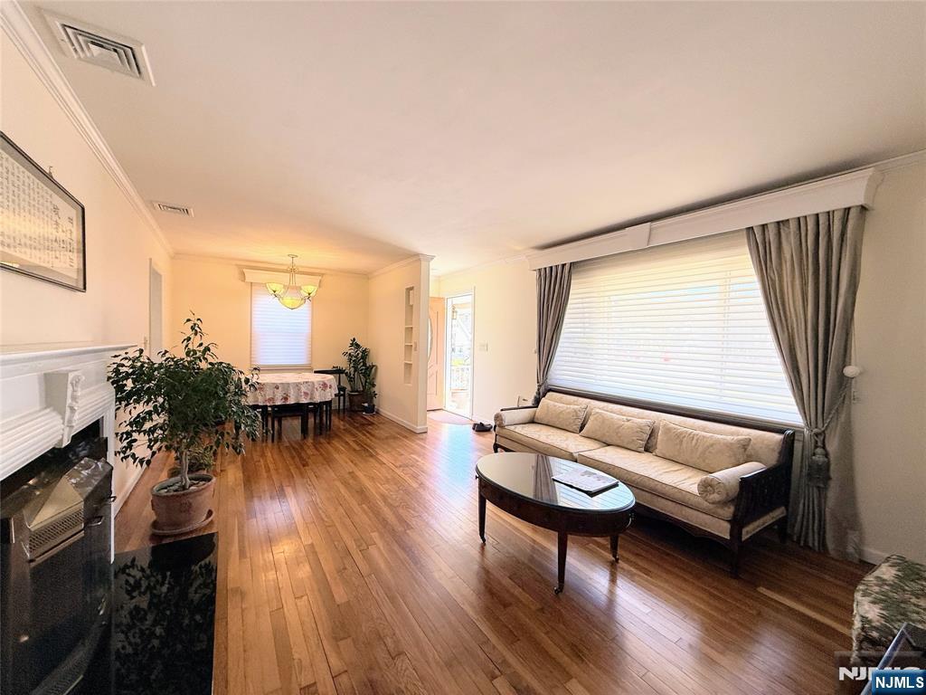 216 Cedar Lane Closter, NJ 07624 - Photo 7 of 15 a living room with furniture and a wooden floor