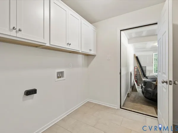 a large bed sitting in a bedroom next to a window