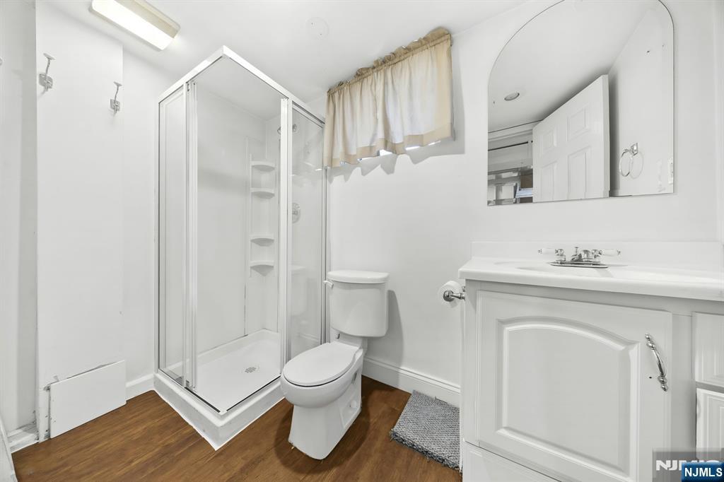 62 Sycamore Road Dumont, NJ 07628 - Photo 29 of 43 a bathroom with a toilet sink and a mirror