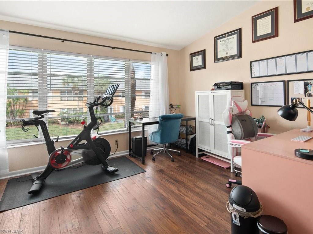 4070 Looking Glass Lane, Unit 3106 Naples, FL 34112 - Photo 9 of 29 a view of a workspace with furniture and a window