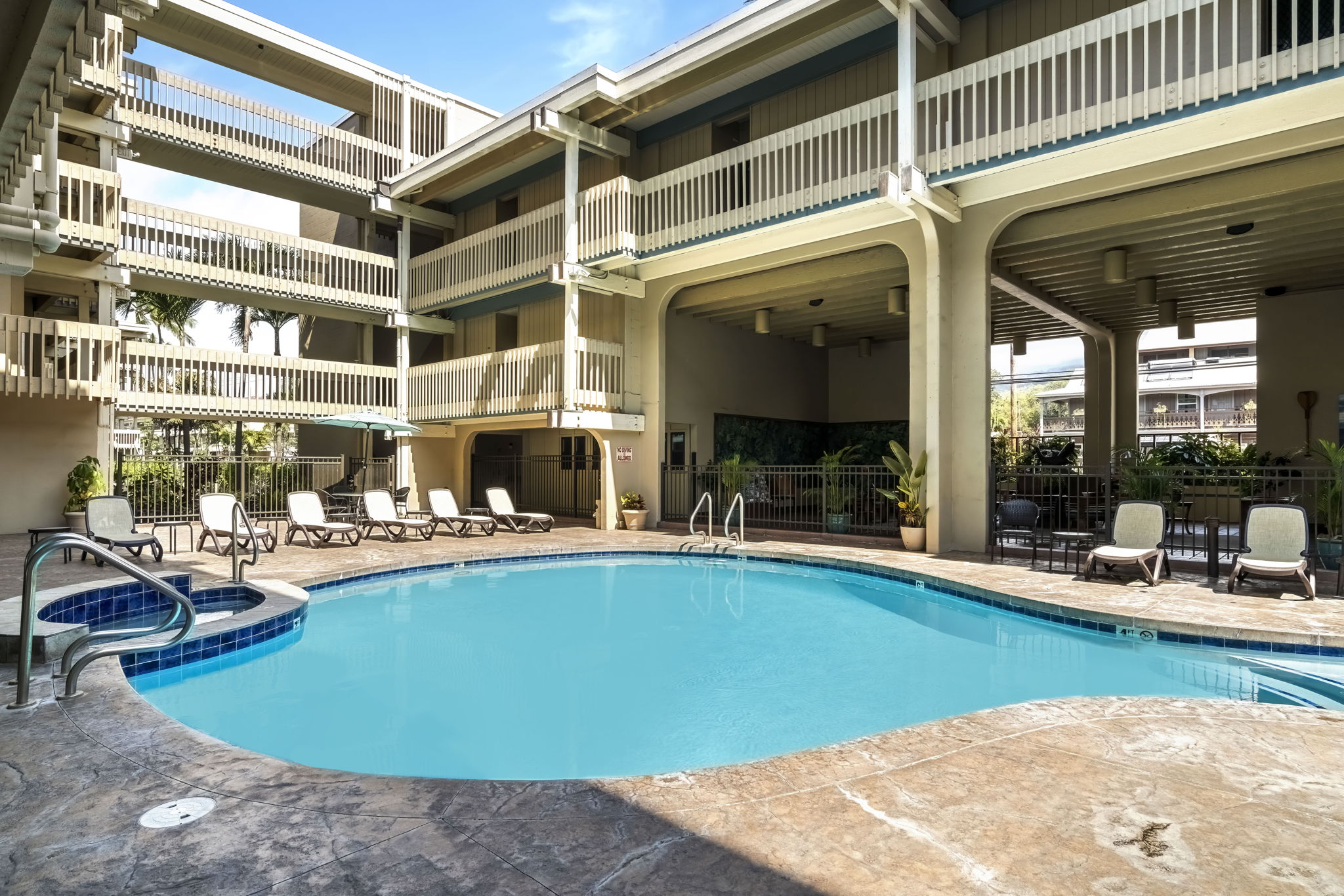 76-6259 Alii Drive, Unit 332 Kailua-Kona, HI 96740 - Photo 19 of 21 a view of a swimming pool with outdoor seating