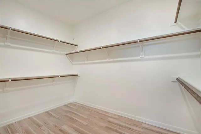 a view of an empty walk in closet