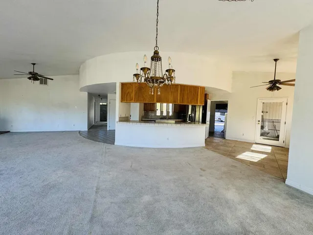 a kitchen with a stove top oven and cabinets