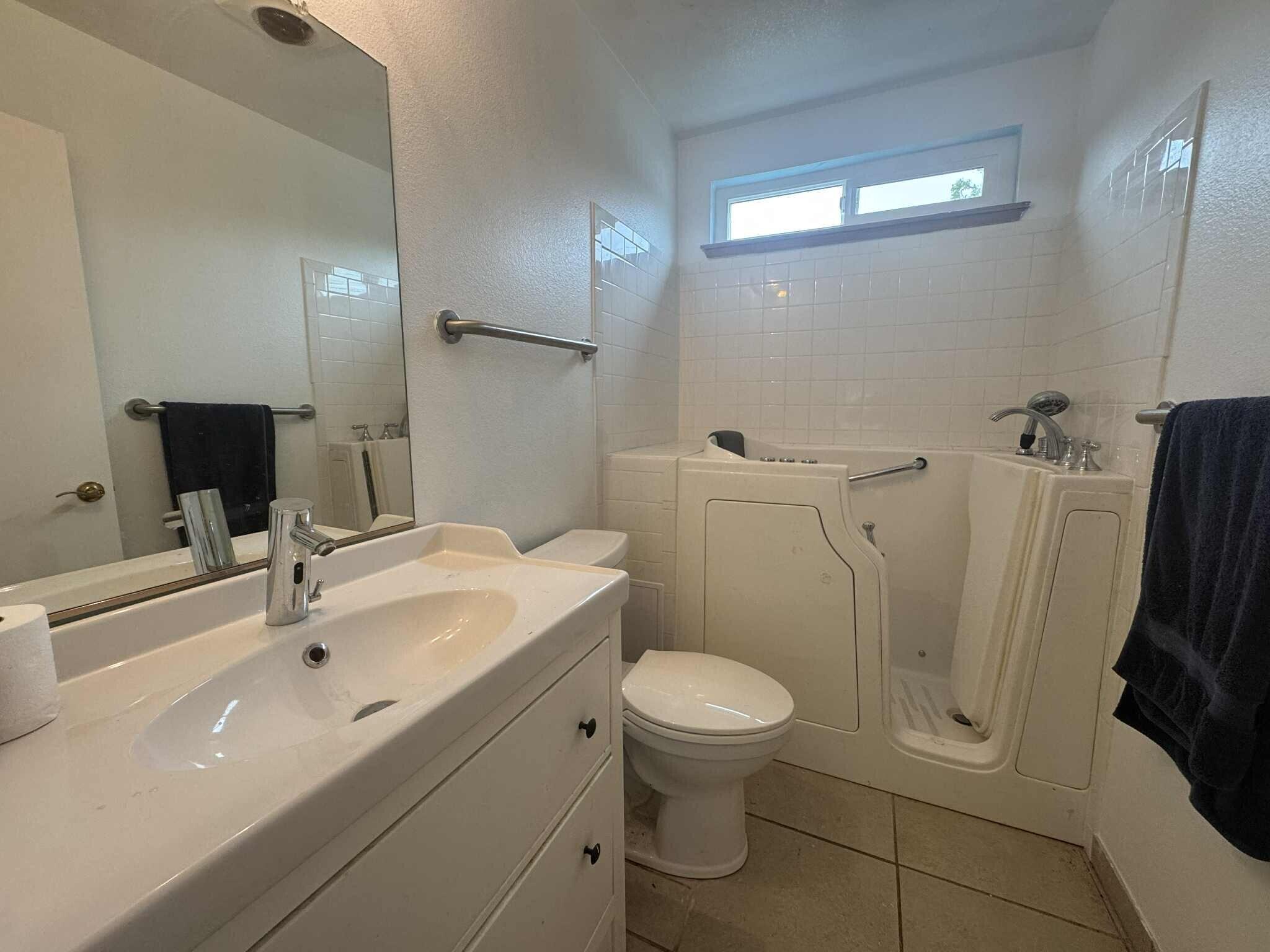 21283 Lela Lane Redding, CA 96003 - Photo 17 of 23 a bathroom with a sink a toilet and a mirror