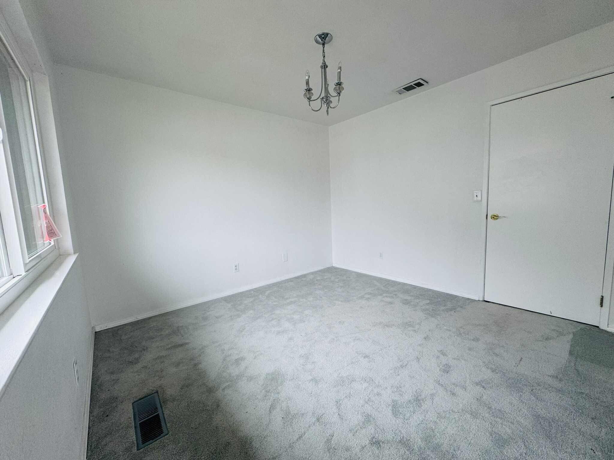 21283 Lela Lane Redding, CA 96003 - Photo 19 of 23 en empty room with windows