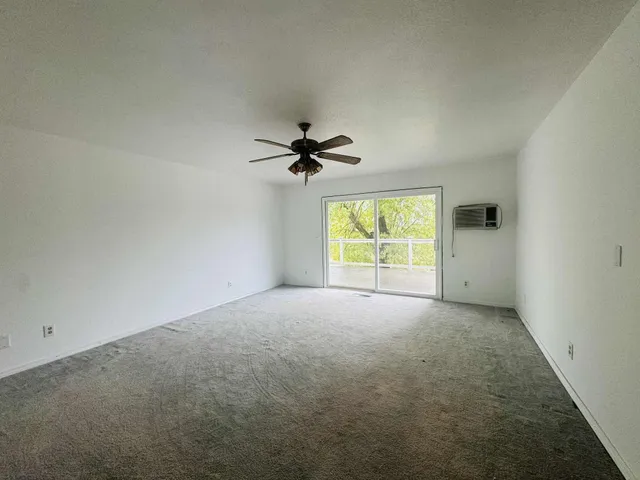 a view of a yard with a tree