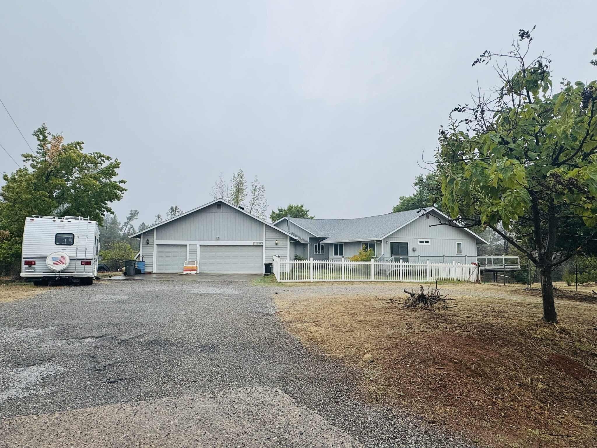21283 Lela Lane Redding, CA 96003 - Photo 2 of 23 a view of large house with a outdoor space