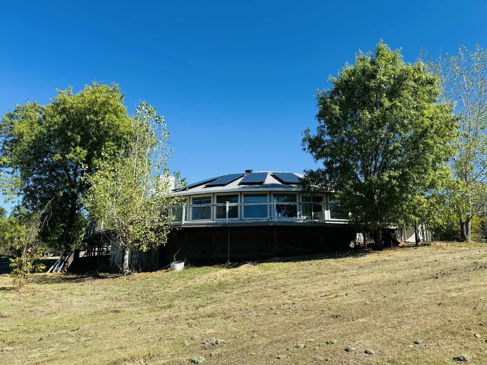 21283 Lela Lane Redding, CA 96003 - Photo 8 of 23 a view of a house with a yard