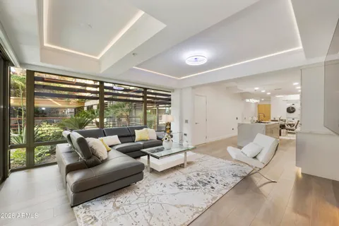 a living room with furniture and a large window