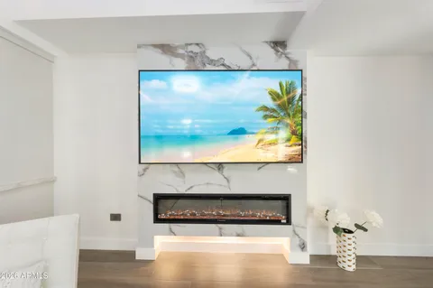 a stone wall with a painting on the wall