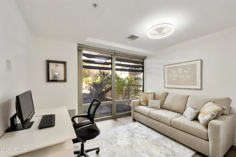 a living room with furniture and a large window